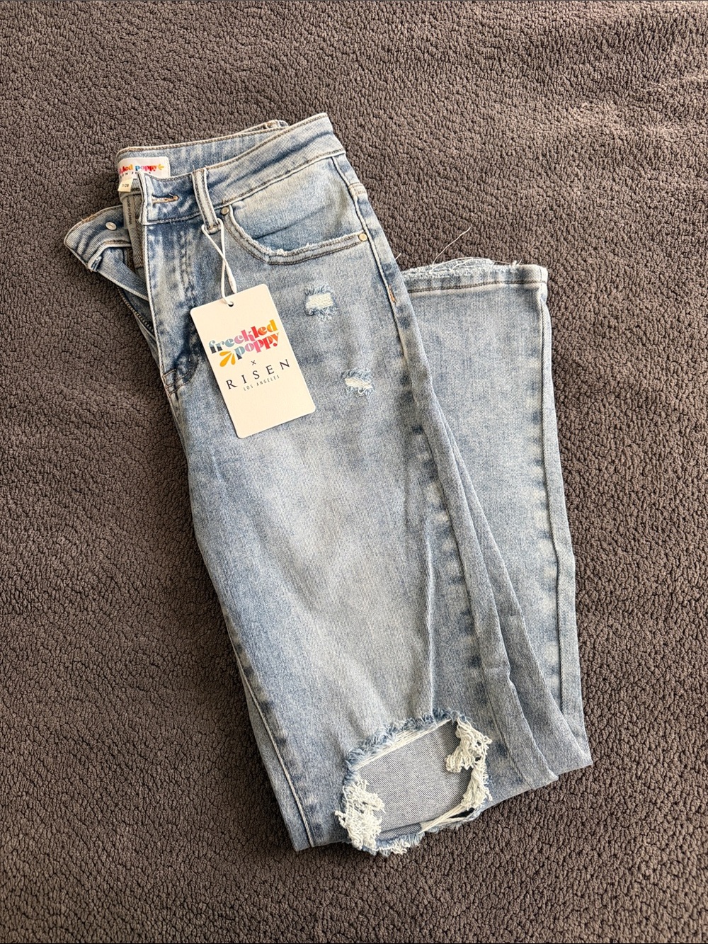 Risen Light Blue High-Rise Straight Jeans with Distressed Knee